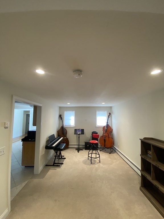 46 Griffin Road Framingham, MA 01701 - Photo 11 of 22 a living room with furniture gym equipment and a ceiling fan