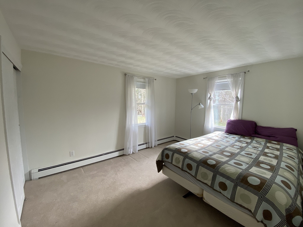 46 Griffin Road Framingham, MA 01701 - Photo 14 of 22 a bedroom with a bed and a window