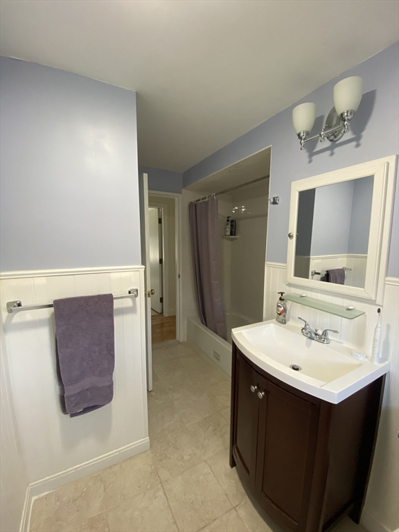 46 Griffin Road Framingham, MA 01701 - Photo 15 of 22 a bathroom with a sink vanity and mirror