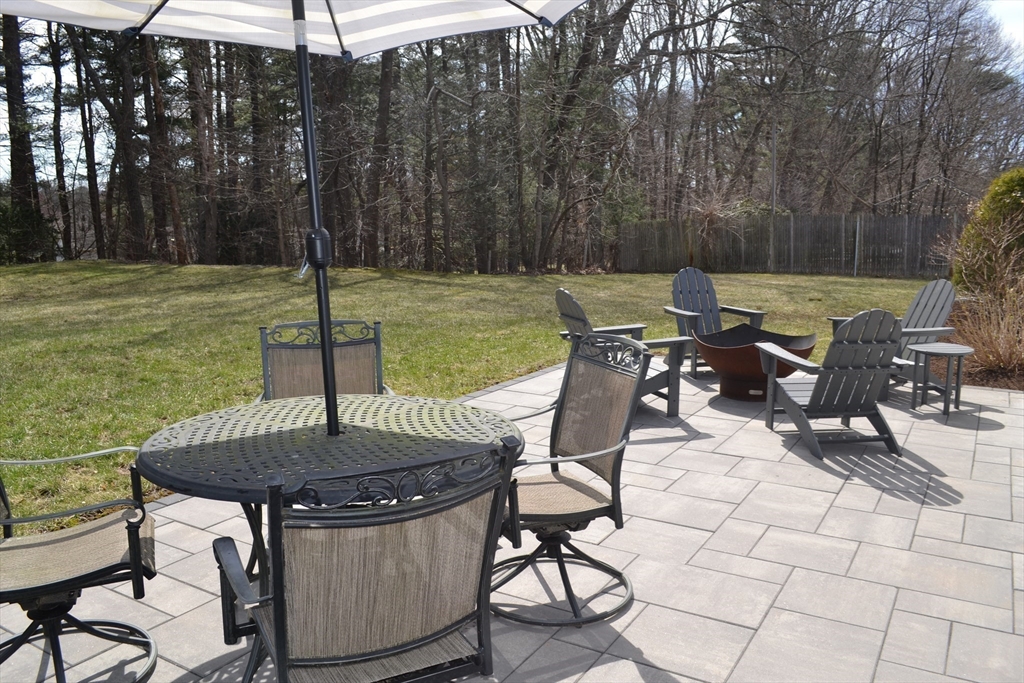 46 Griffin Road Framingham, MA 01701 - Photo 5 of 22 a view of backyard with table and chairs