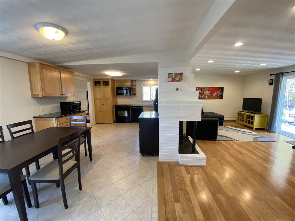 46 Griffin Road Framingham, MA 01701 - Photo 6 of 22 a living room with furniture and a flat screen tv