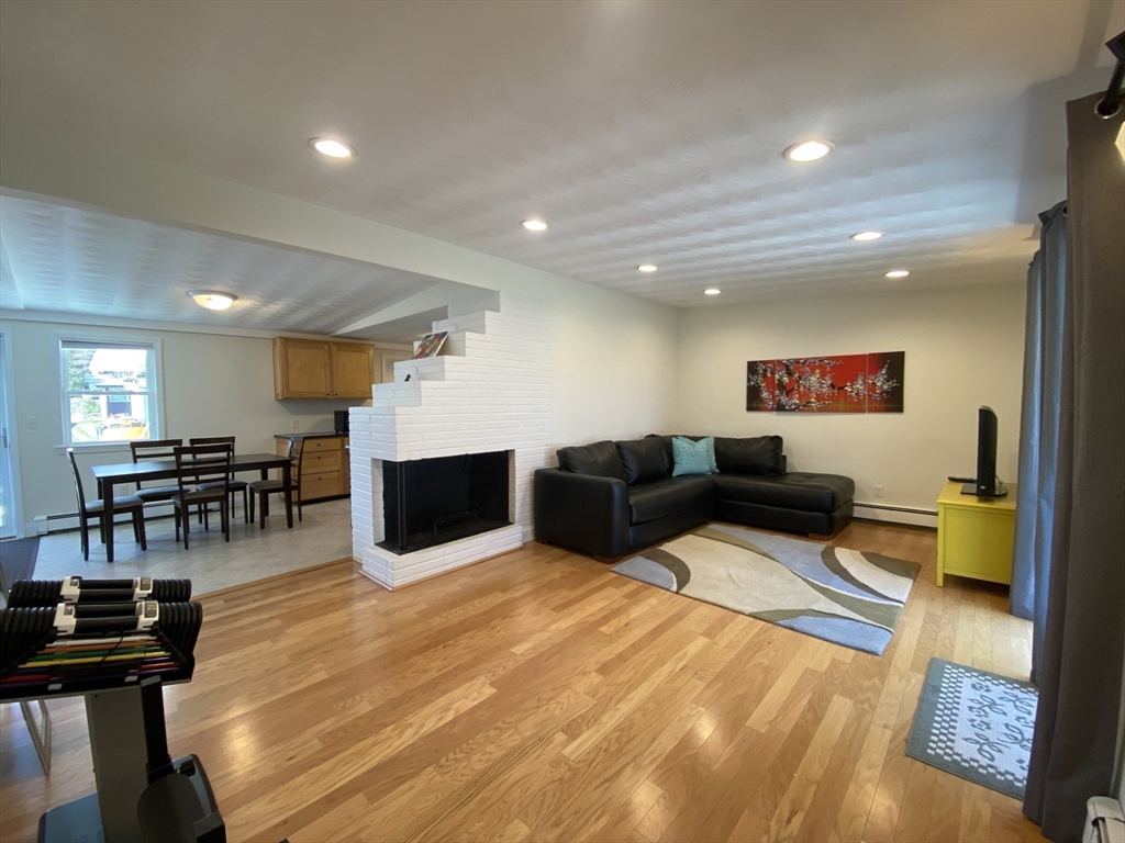 46 Griffin Road Framingham, MA 01701 - Photo 10 of 22 a living room with furniture and a flat screen tv