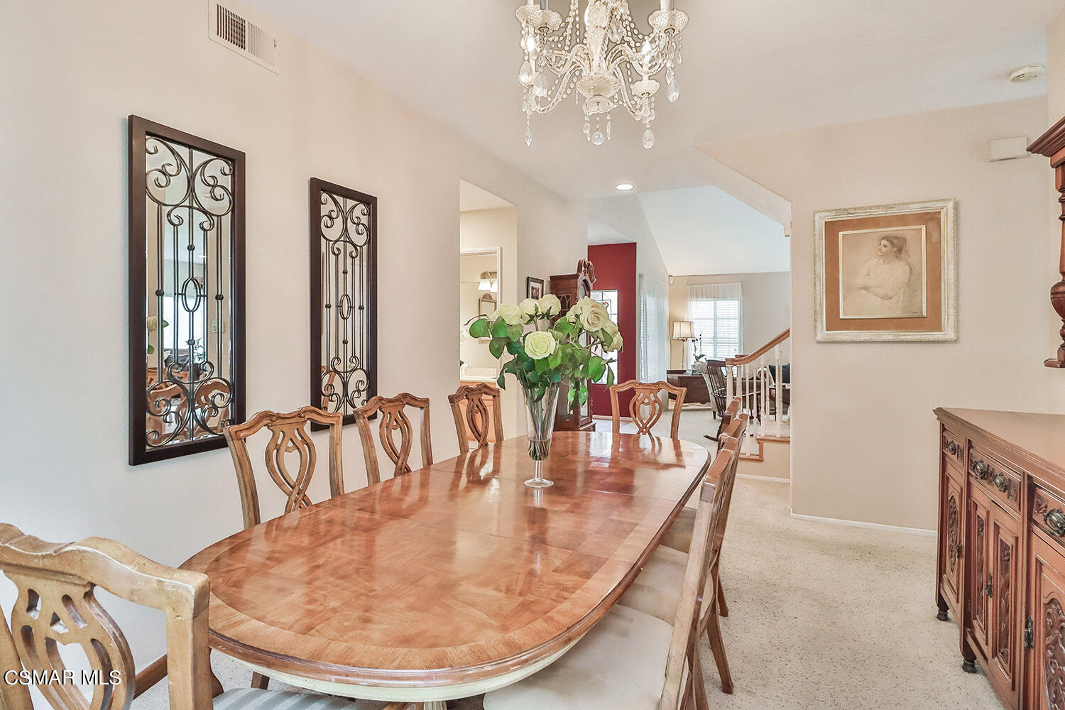 7176 University Drive Moorpark, CA 93021 - Photo 15 of 74 a dining room with furniture a livingroom and chandelier