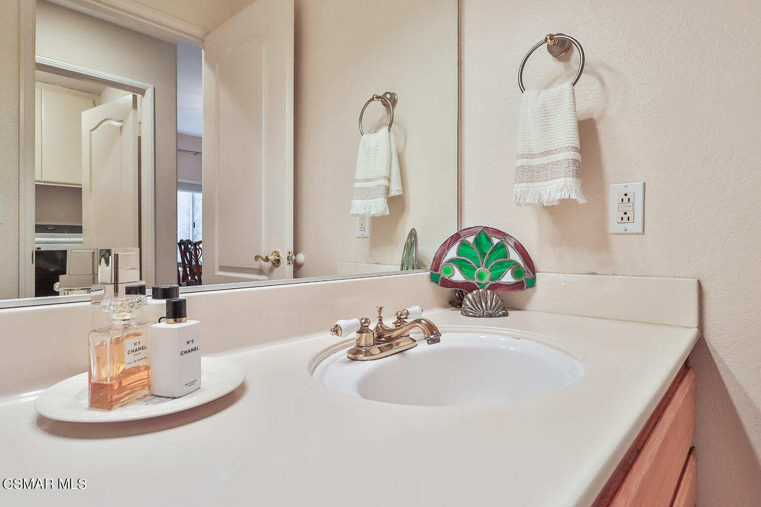 7176 University Drive Moorpark, CA 93021 - Photo 18 of 74 a bathroom with a sink and a mirror
