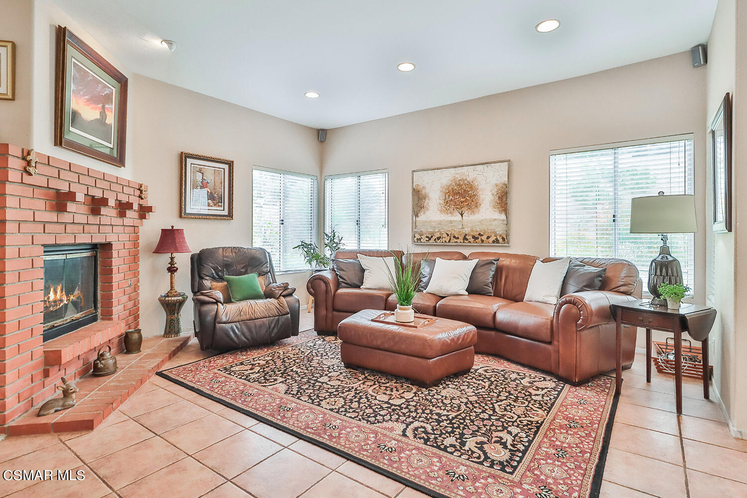 7176 University Drive Moorpark, CA 93021 - Photo 19 of 74 a living room with furniture and a fireplace