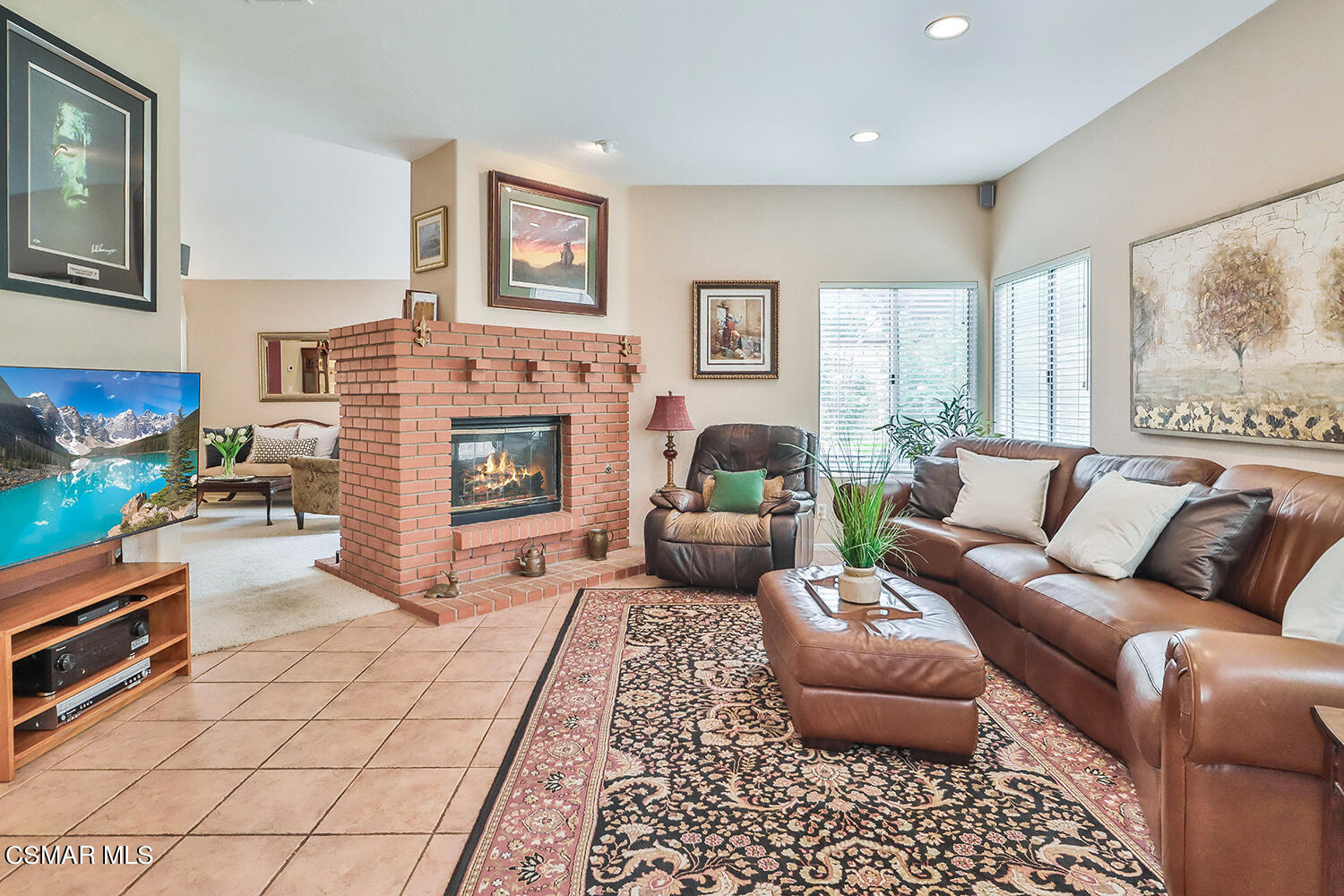 7176 University Drive Moorpark, CA 93021 - Photo 20 of 74 a living room with furniture and a fireplace