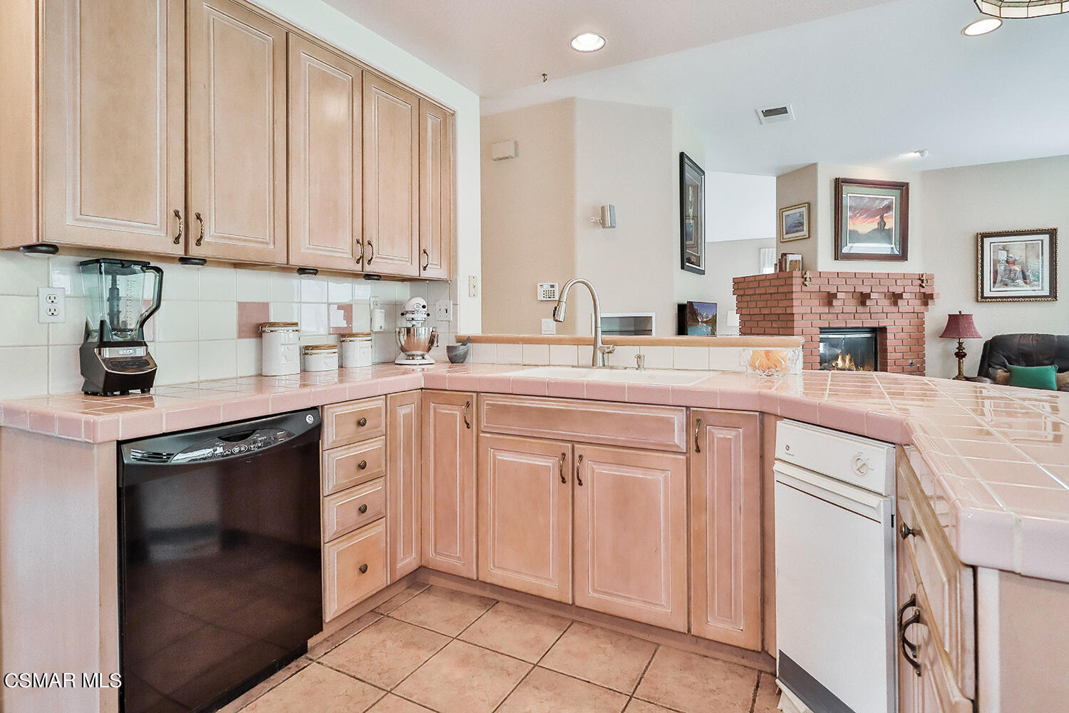 7176 University Drive Moorpark, CA 93021 - Photo 25 of 74 a kitchen with stainless steel appliances granite countertop white cabinets sink and dishwasher