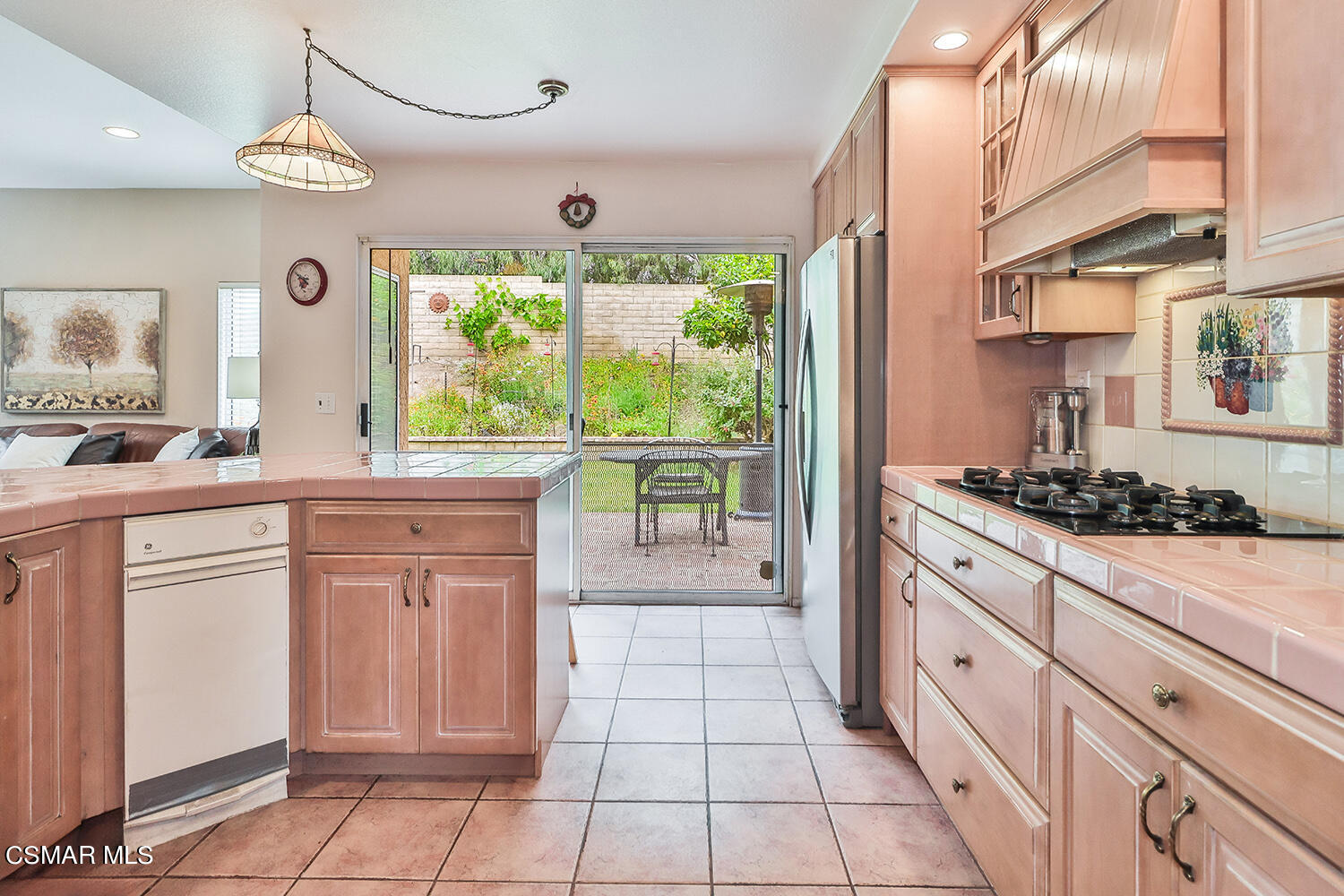7176 University Drive Moorpark, CA 93021 - Photo 26 of 74 a kitchen with stainless steel appliances granite countertop a stove a sink and a refrigerator