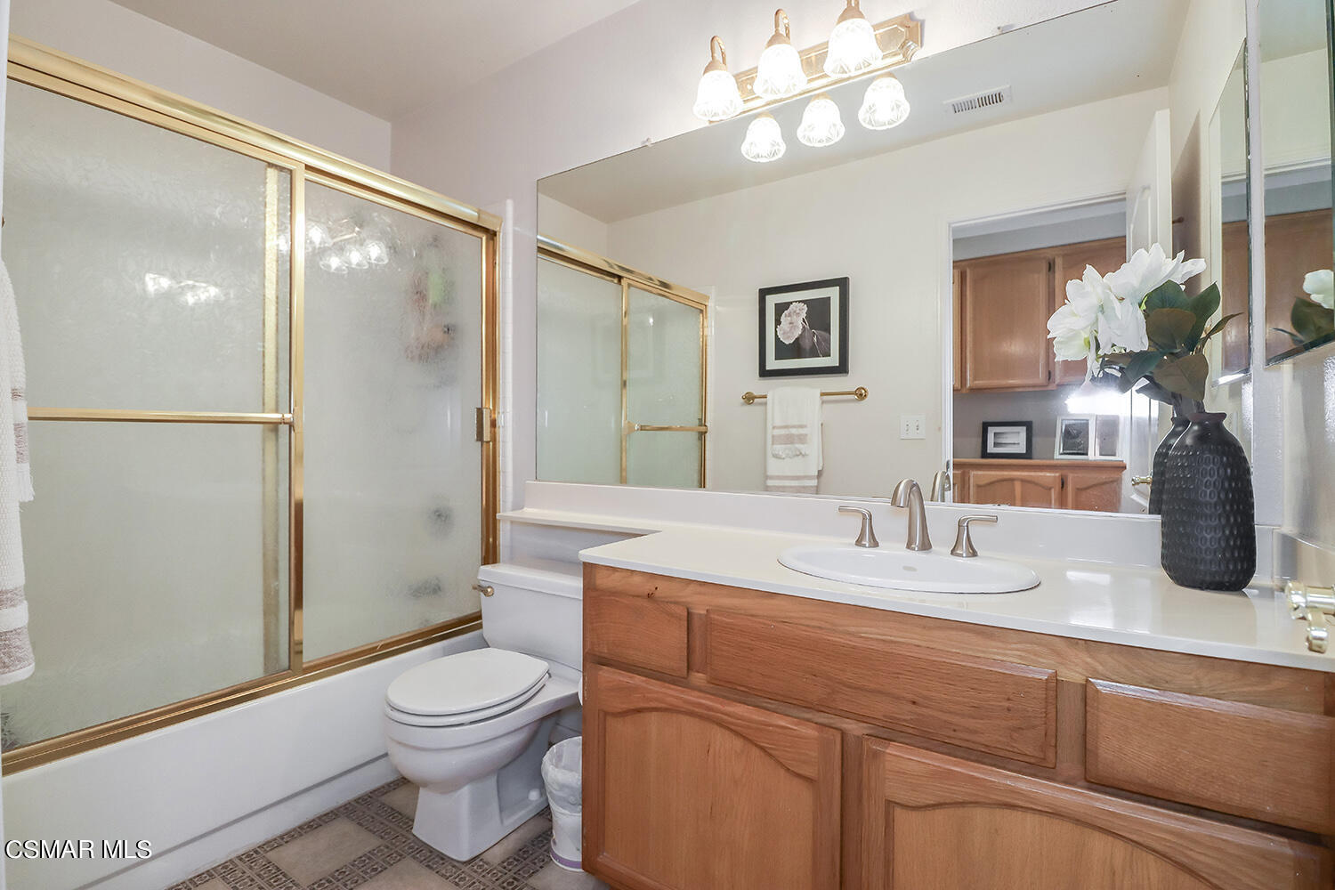 7176 University Drive Moorpark, CA 93021 - Photo 36 of 74 a bathroom with a toilet a sink and a large mirror