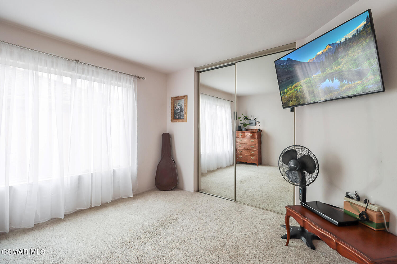 7176 University Drive Moorpark, CA 93021 - Photo 41 of 74 a room with a window and a chandelier