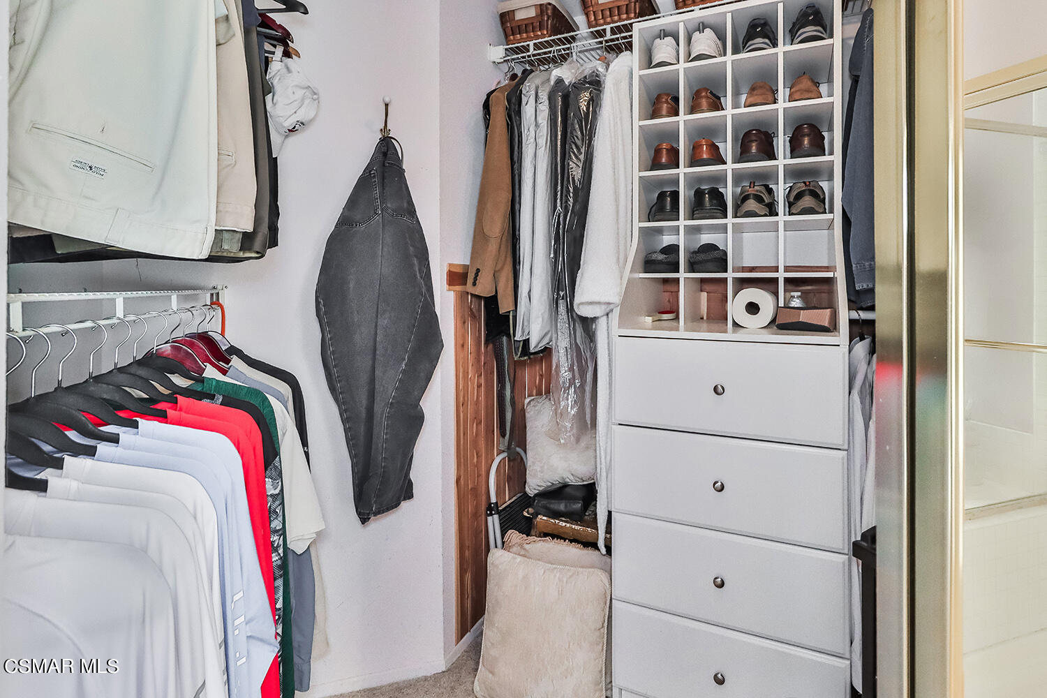 7176 University Drive Moorpark, CA 93021 - Photo 51 of 74 a view of walk in closet with clothes and shoes
