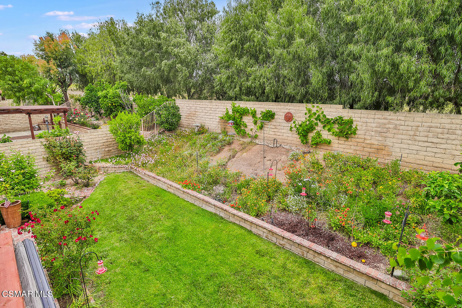 7176 University Drive Moorpark, CA 93021 - Photo 54 of 74 a view of a garden with an outdoor seating