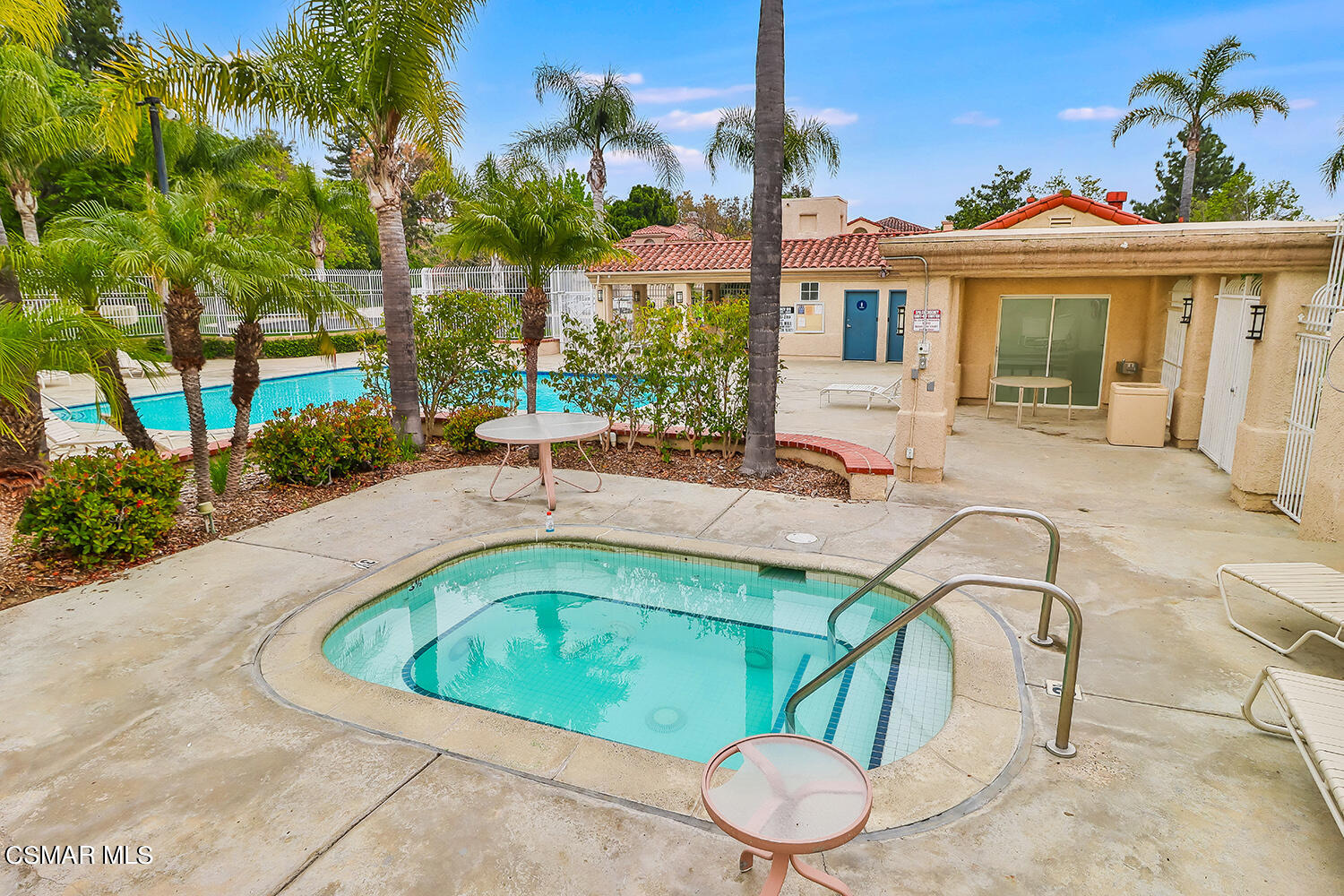 7176 University Drive Moorpark, CA 93021 - Photo 72 of 74 a view of a house with a swimming pool and sitting area