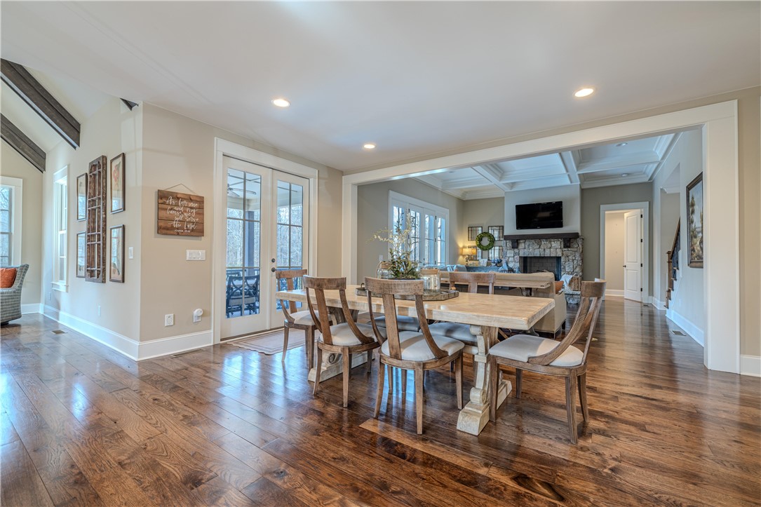 301 Stonebridge Drive Clemson, SC 29631 - Photo 8 of 47 This inviting space features rich wood flooring, elegant French doors, and an impressive stone fireplace.