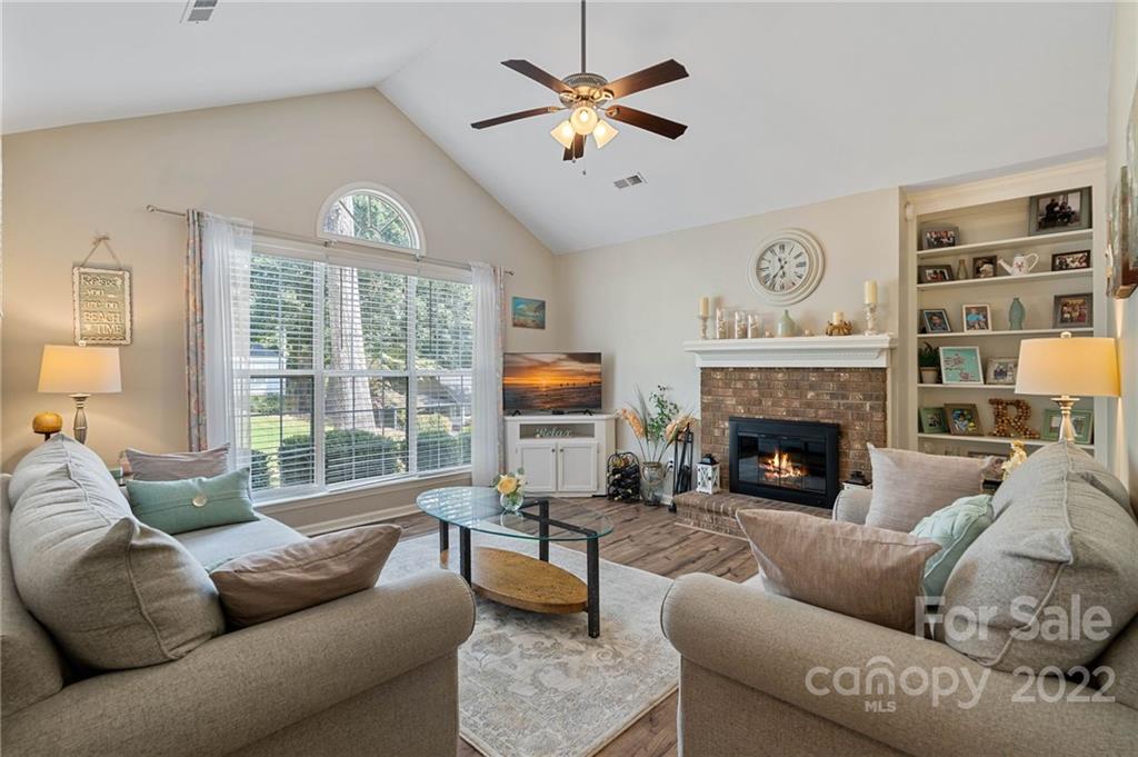 7192 Brookridge Drive Denver, NC 28037 - Photo 11 of 30 a living room with furniture and a fireplace