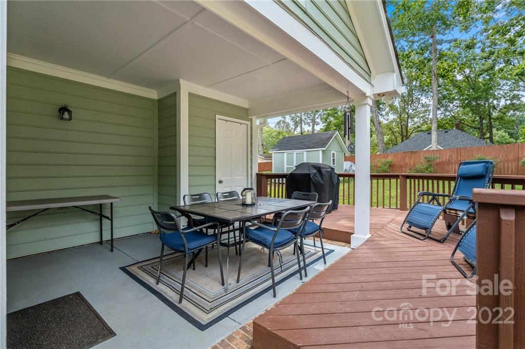 7192 Brookridge Drive Denver, NC 28037 - Photo 21 of 30 a view of a patio with a dining table and chairs