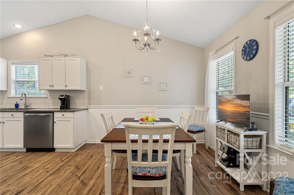 7192 Brookridge Drive Denver, NC 28037 - Photo 6 of 30 a kitchen with stainless steel appliances a stove a refrigerator and a stove