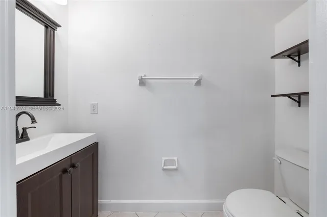 a bathroom with a toilet sink and shower