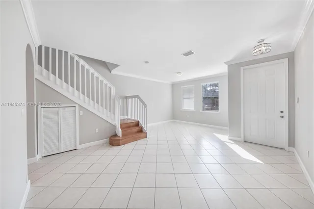 a view of an empty room and entryway