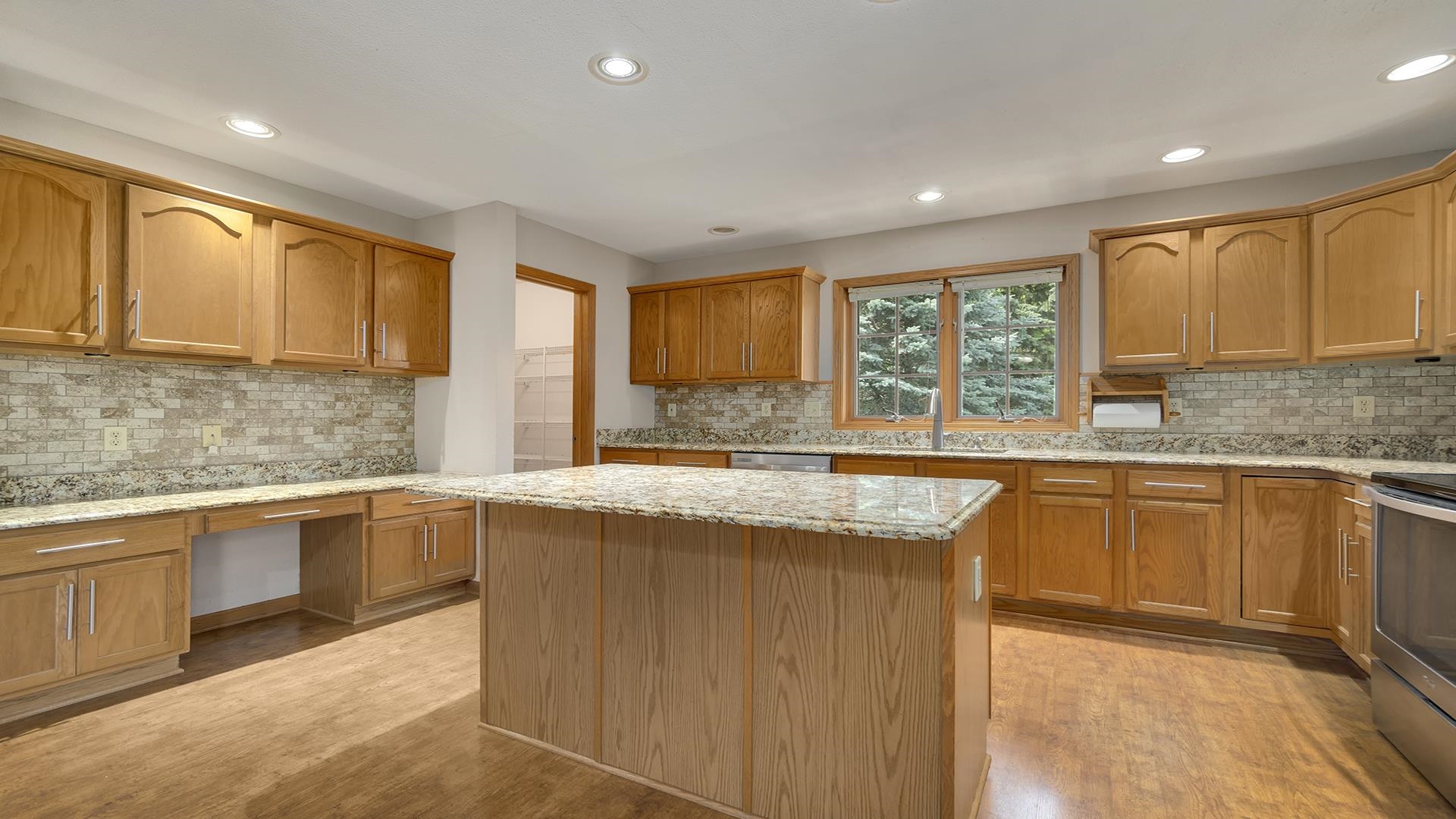 16405 Cannell Road Rockton, IL 61072 - Photo 20 of 53 a kitchen with stainless steel appliances granite countertop sink stove top oven and cabinets
