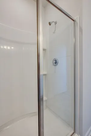 a bathroom with a sink a tub and a mirror