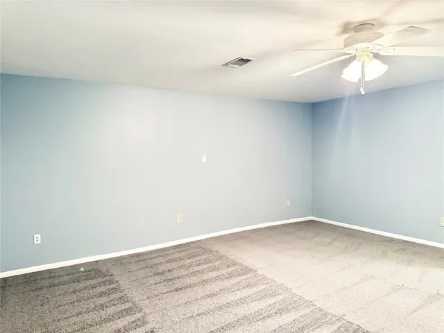 a view of a yard with a tree