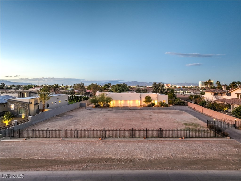 3910 West Pebble Road Las Vegas, NV 89139 - Photo 2 of 59 View of front of house a fenced front yard, and a residential view