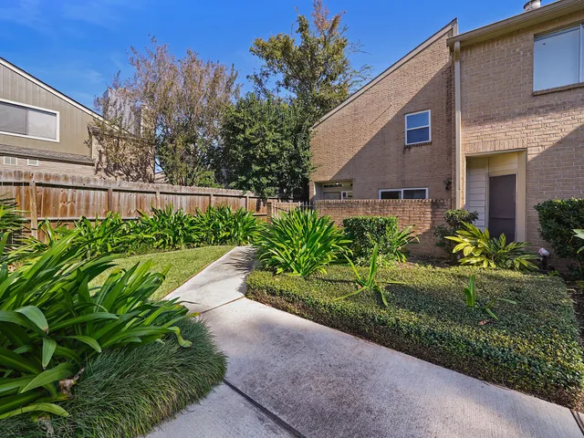 a view of a garden with pathway
