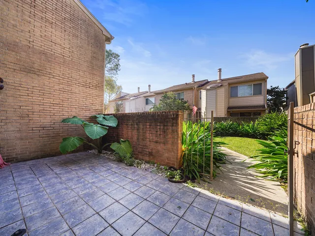 a view of a backyard with sitting area