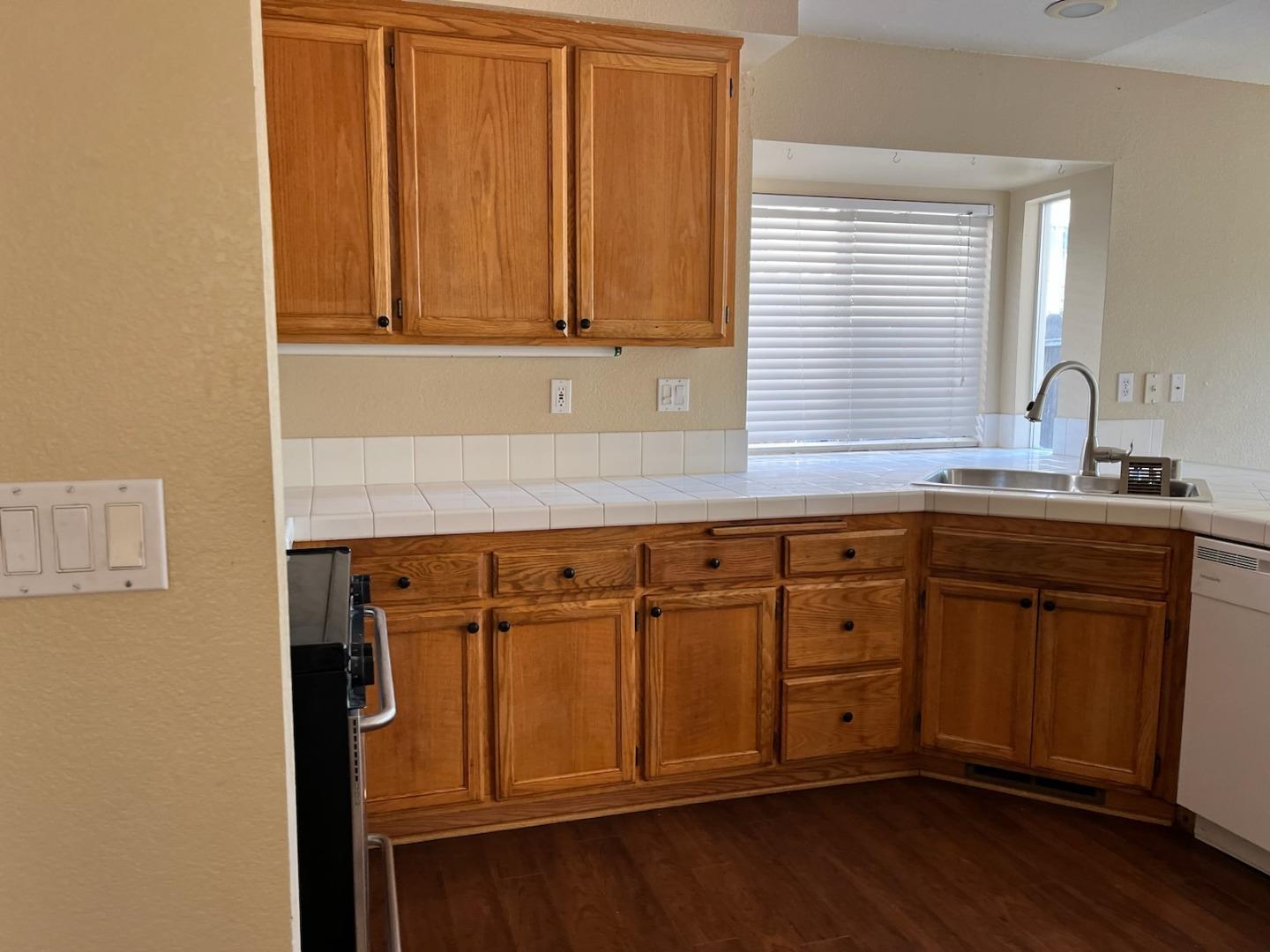 4259 Merced Circle Antioch, CA 94531 - Photo 6 of 21 a kitchen with stainless steel appliances granite countertop a sink a cabinets and wooden floor