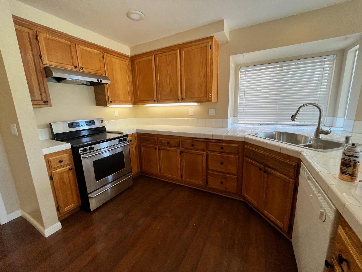 4259 Merced Circle Antioch, CA 94531 - Photo 7 of 21 a kitchen with stainless steel appliances granite countertop a sink a stove and a refrigerator