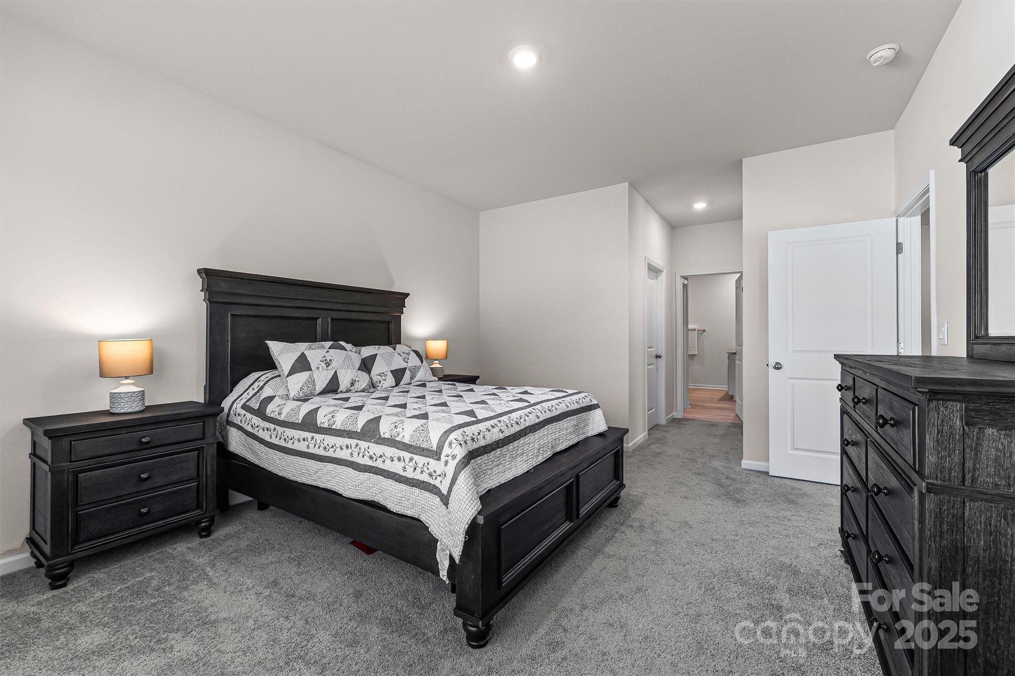 1219 Rutherford Street York, SC 29745 - Photo 15 of 38 a bedroom with a bed and a mirror on dresser