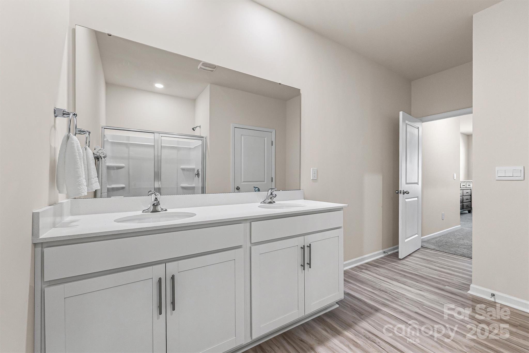 1219 Rutherford Street York, SC 29745 - Photo 17 of 38 a bathroom with a double vanity sink and a mirror