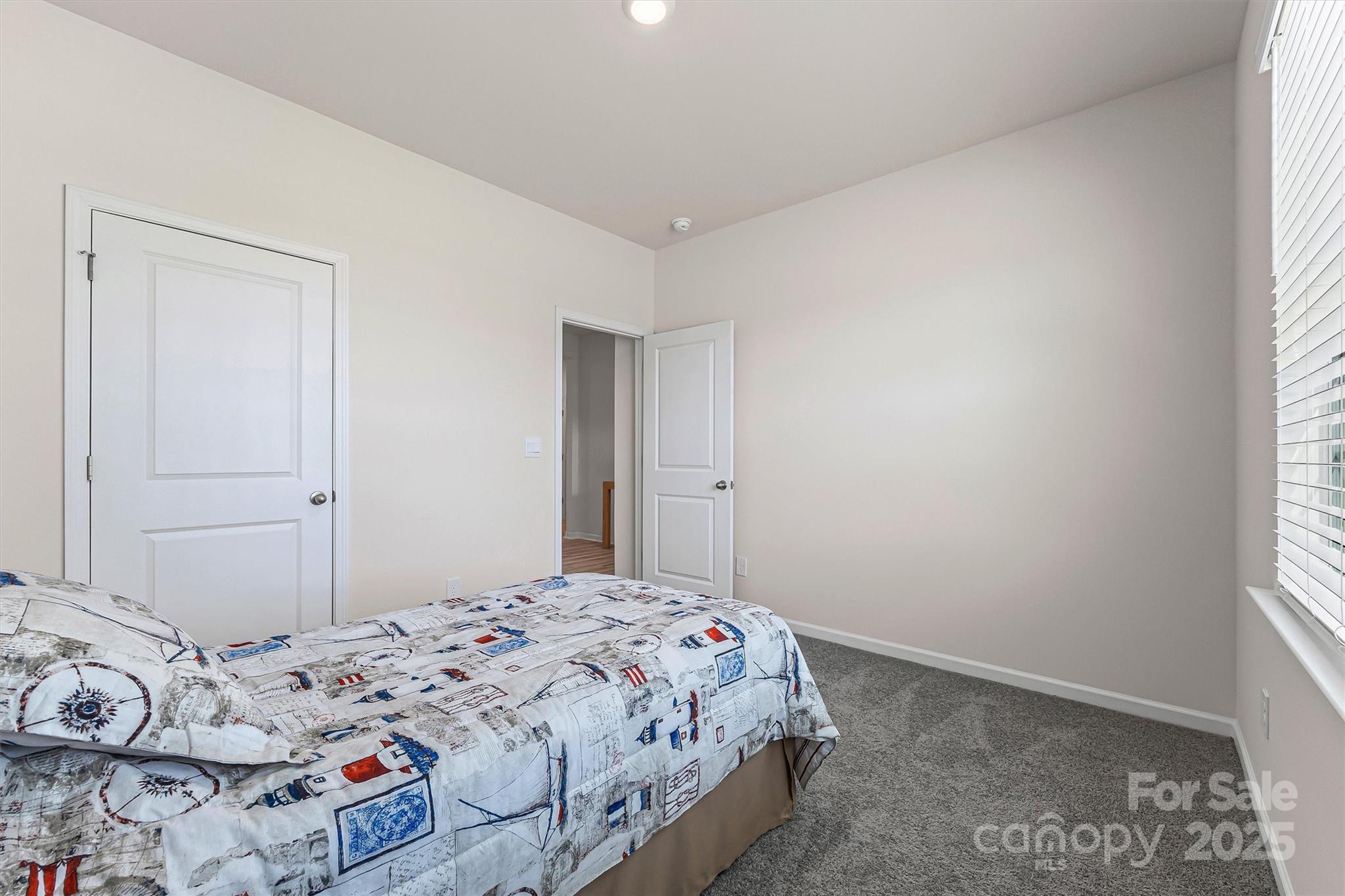 1219 Rutherford Street York, SC 29745 - Photo 20 of 38 a bedroom with a bed and a window