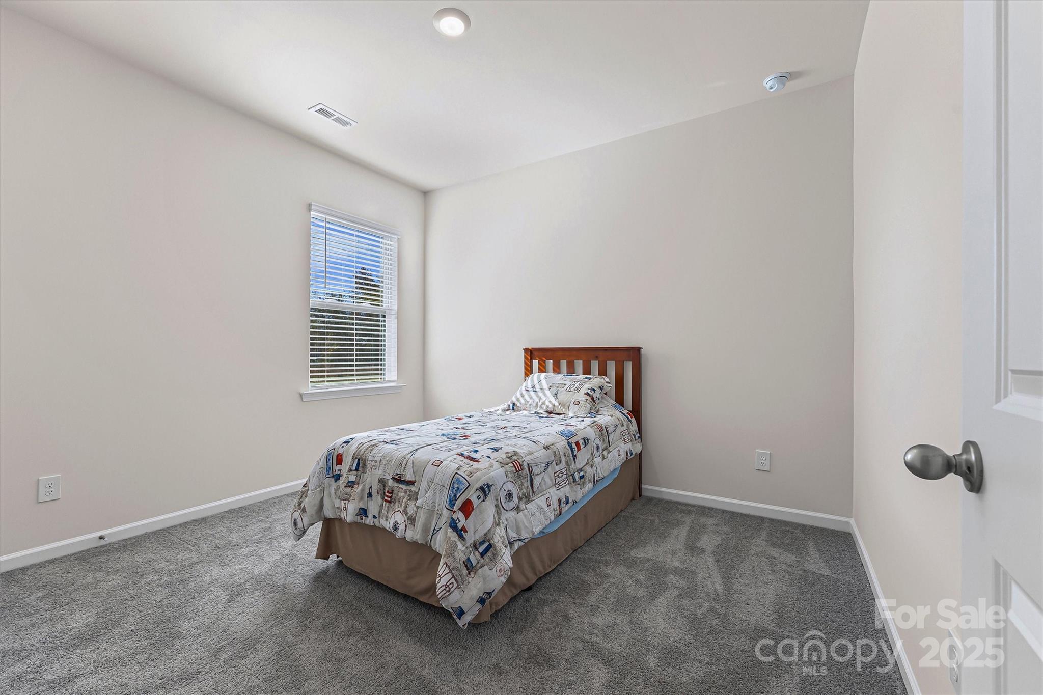 1219 Rutherford Street York, SC 29745 - Photo 22 of 38 a bedroom with a bed and a window