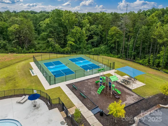 a view of a swimming pool with lounge chair