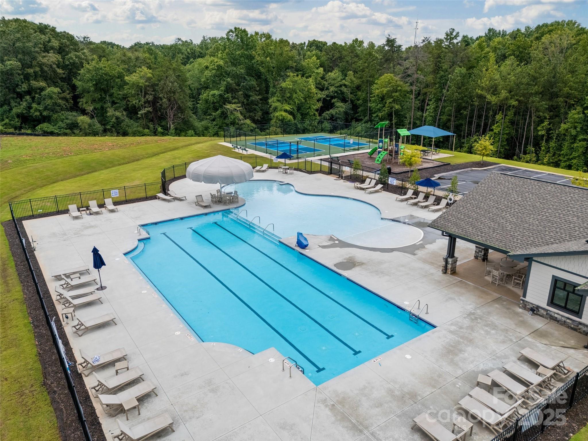 1219 Rutherford Street York, SC 29745 - Photo 35 of 38 a view of a swimming pool with a lounge chairs