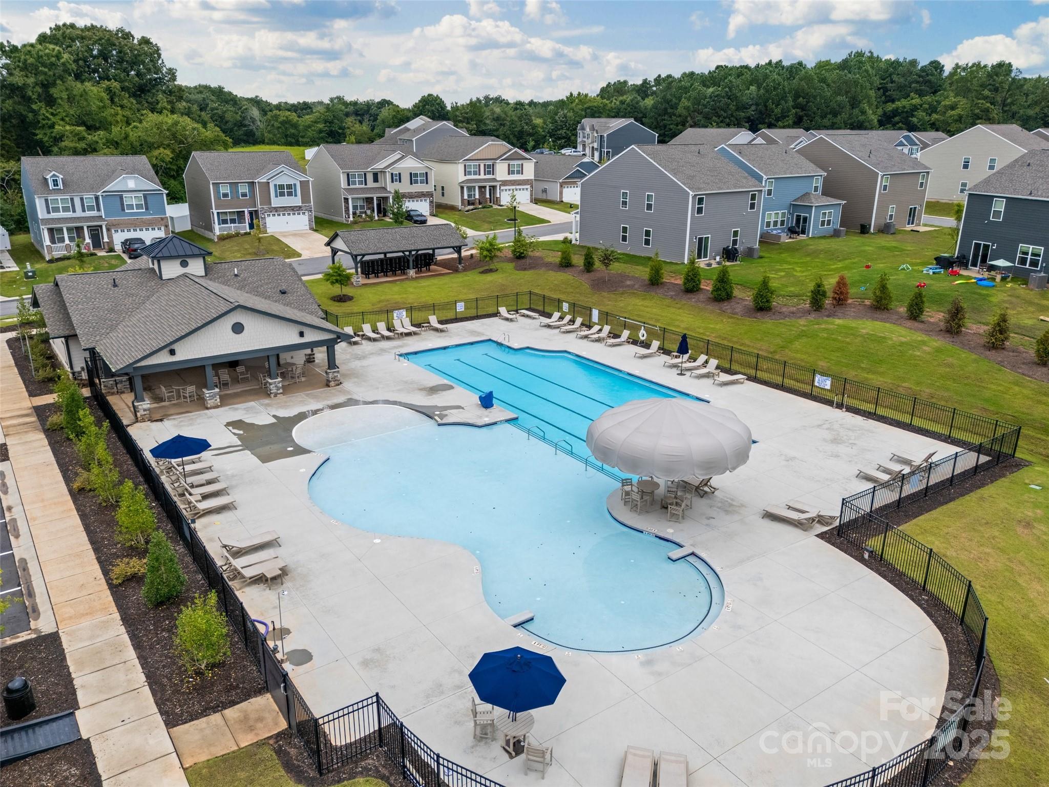 1219 Rutherford Street York, SC 29745 - Photo 36 of 38 a view of a house with pool and chairs