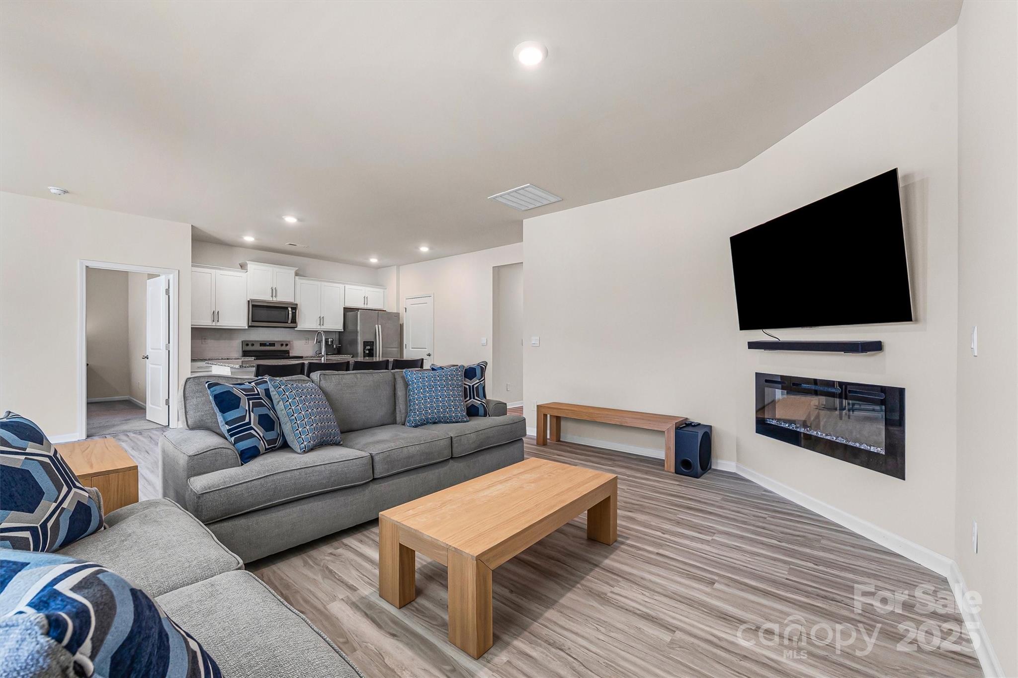 1219 Rutherford Street York, SC 29745 - Photo 6 of 38 a living room with furniture and a flat screen tv