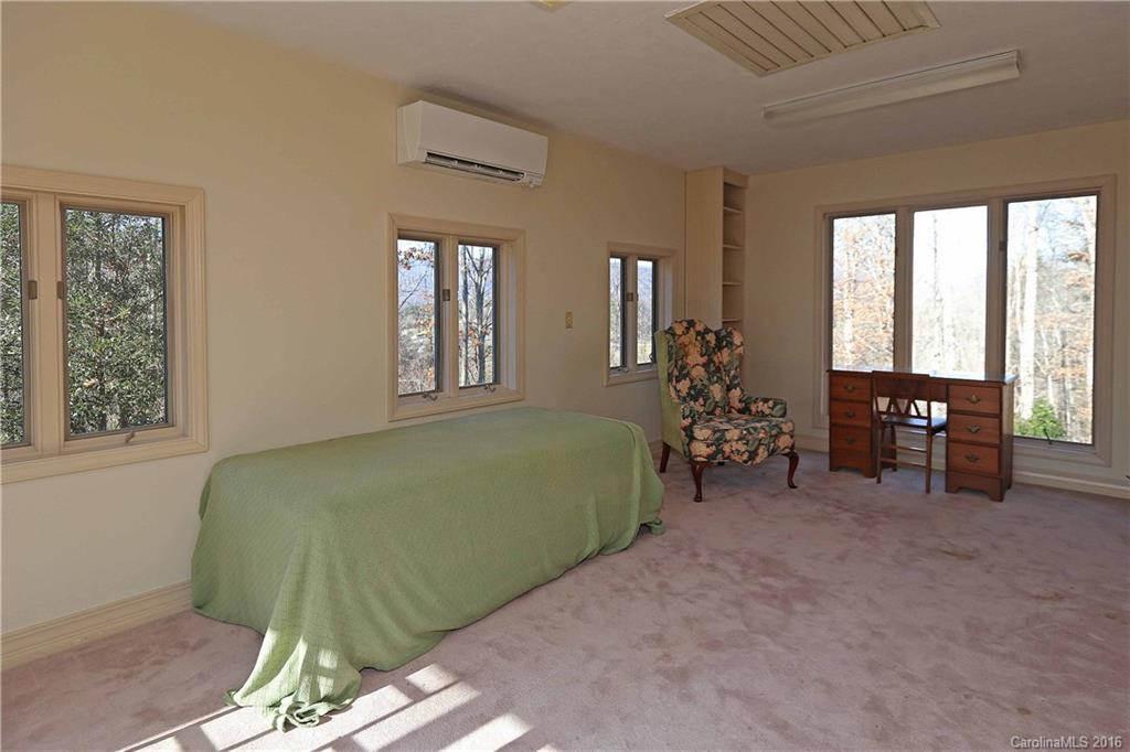 435 Clemson Road Waynesville, NC 28786 - Photo 13 of 21 a living room with furniture and a large window