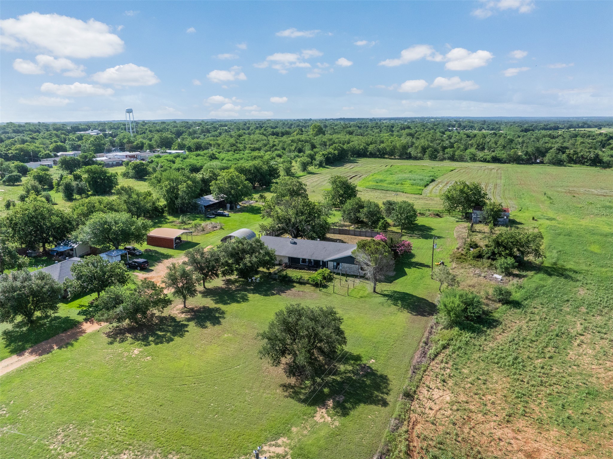 1015 FM 112 Road Lexington, TX 78947 - Photo 32 of 38 a view of a lake with a city