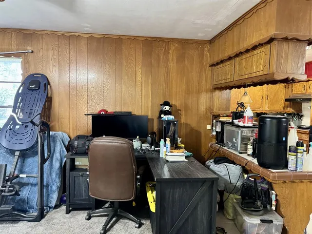 a view of a workspace with furniture