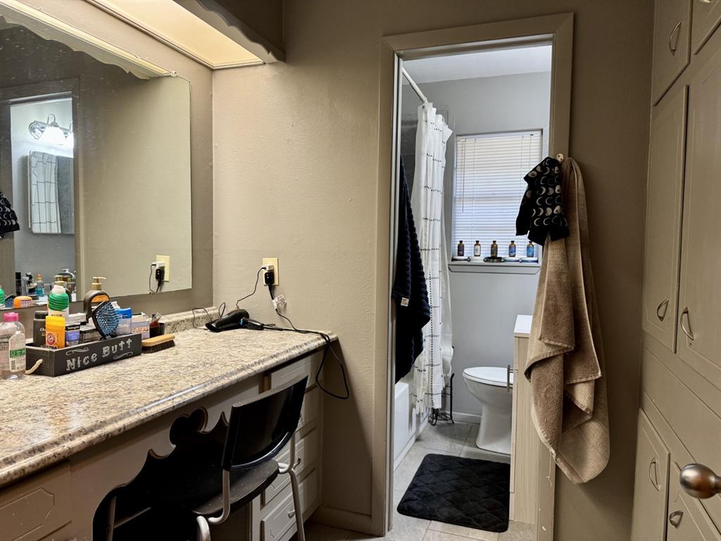 609 South Files Street Itasca, TX 76055 - Photo 20 of 29 a kitchen with a sink a stove and cabinets