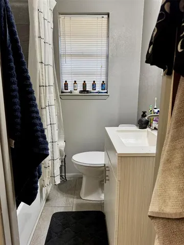 a bathroom with a sink and toilet