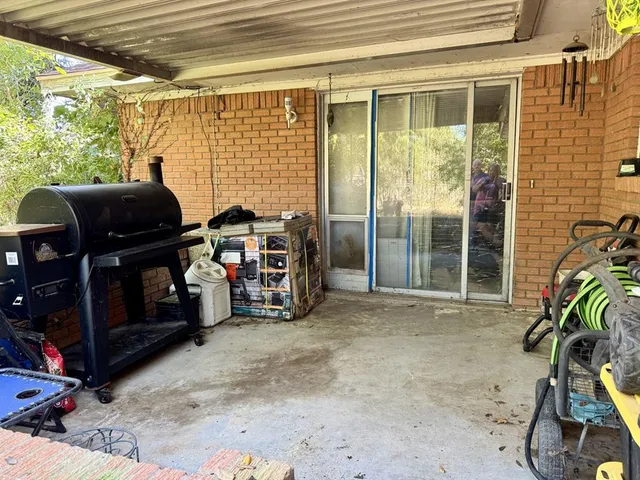 a view of a room with furniture and windows