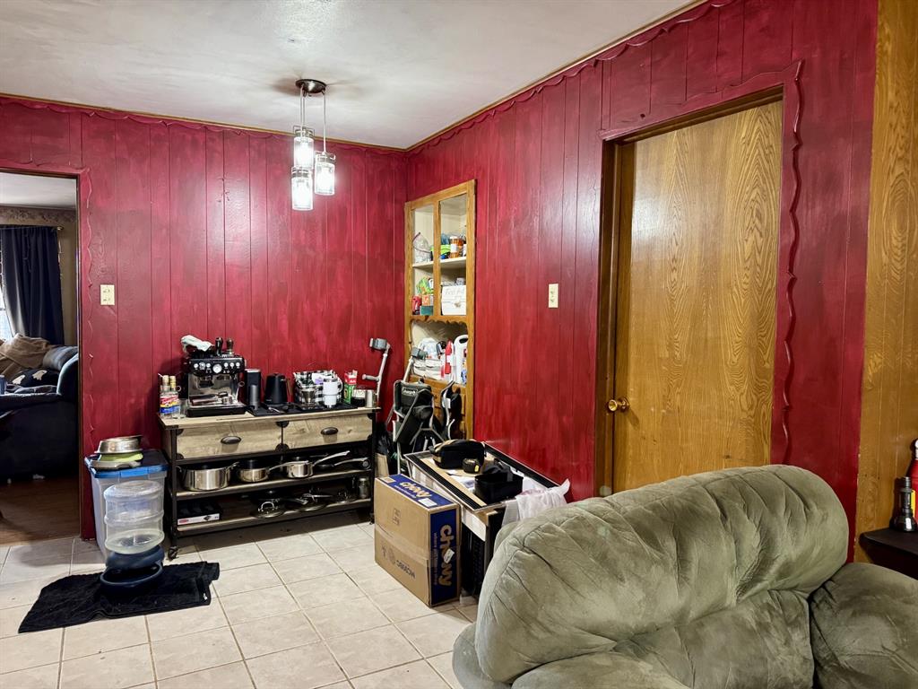 609 South Files Street Itasca, TX 76055 - Photo 10 of 29 a bed room with a bed and furniture