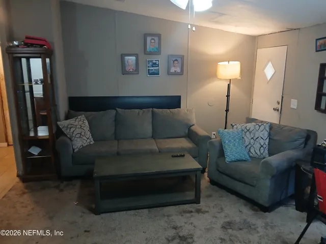 a living room with furniture and a couch