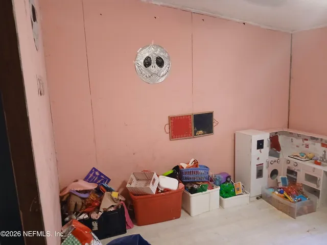 a view of a storage & utility room with racks on the wall