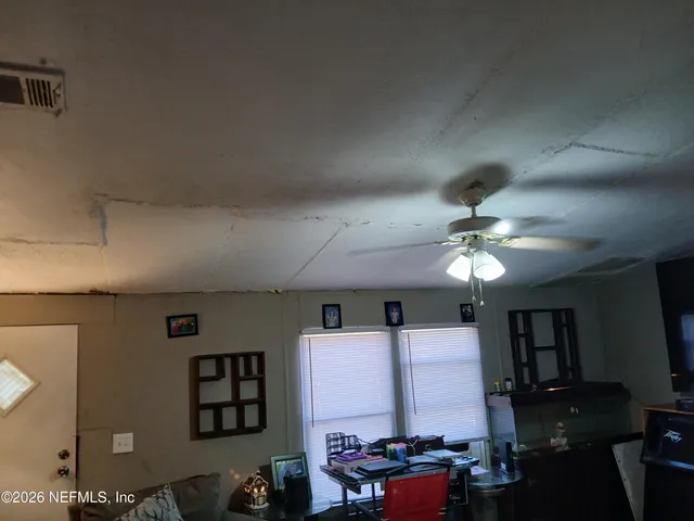 a view of a livingroom with furniture