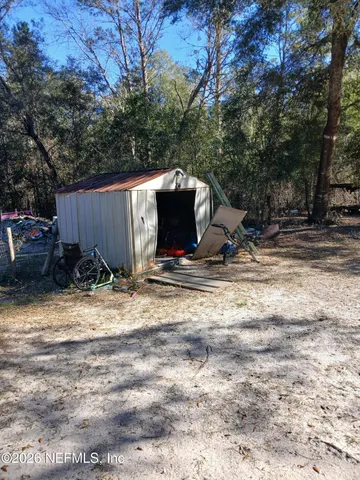 a view of a backyard of the house